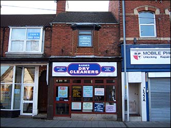 The Singer Sewing Machine shop is now Barnes Drycleaners