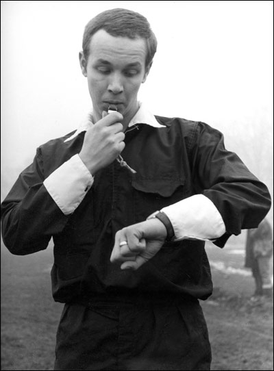 The referee blows his whistle