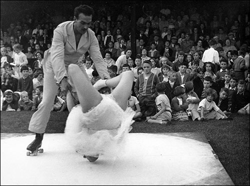 Skaters entertaining the crowd at a carnival