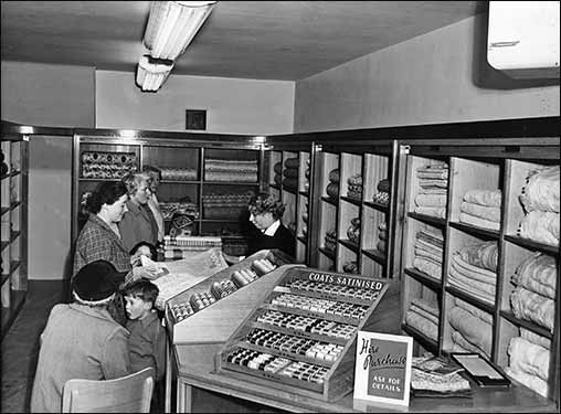 Mary M ould serving a customer
