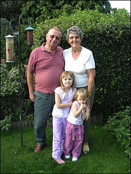 John & wife Pat with granddaughters in 2008